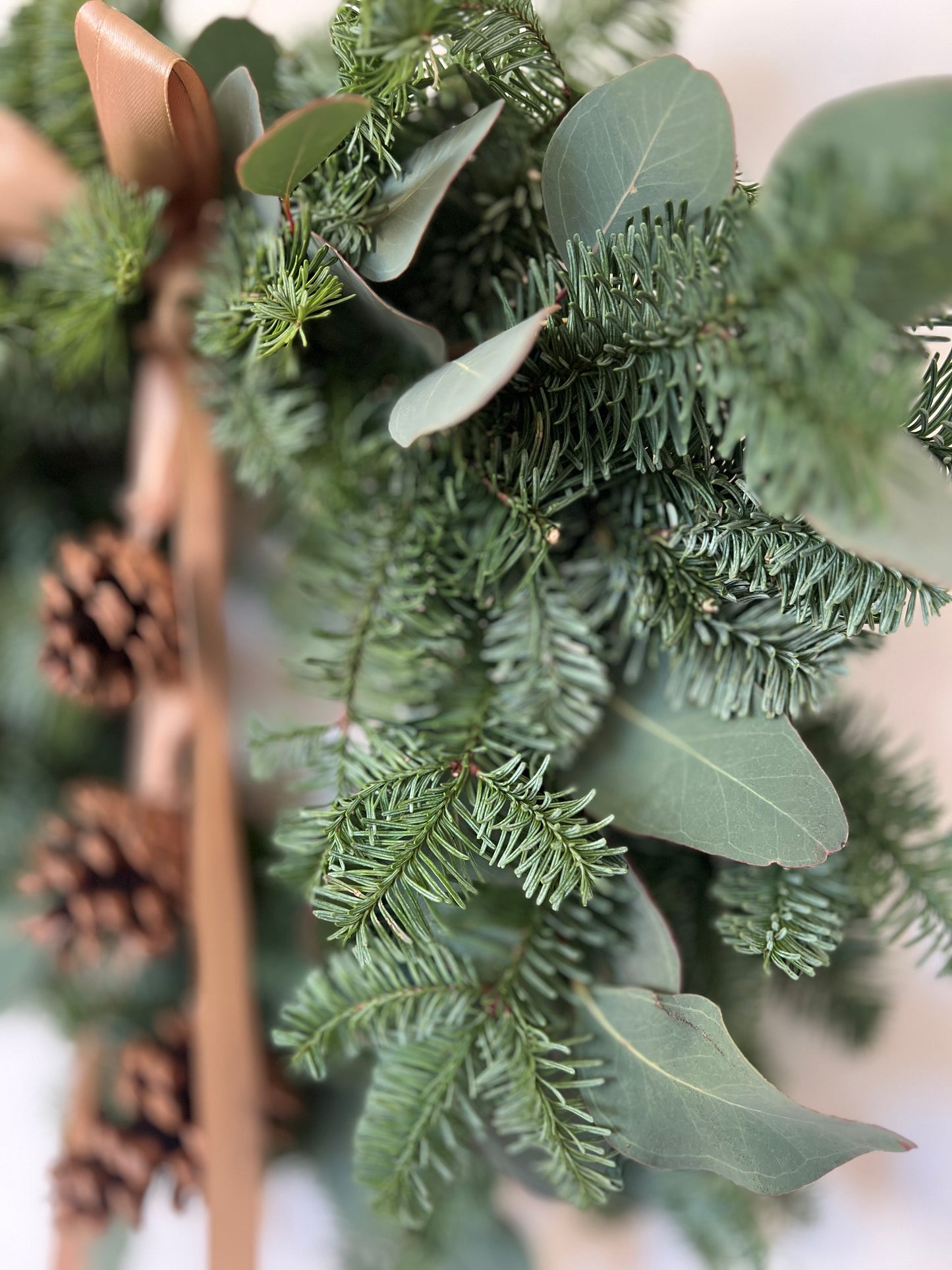 Christmas Wreath with Fresh Nordic Greenery, Eucalyptus, Pinecones, and Gold Ribbon