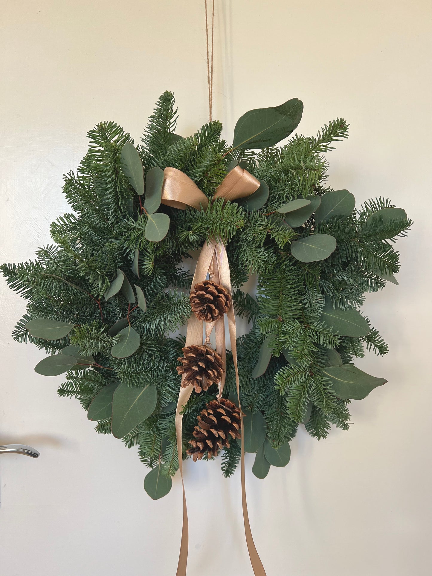 Christmas Wreath with Fresh Nordic Greenery, Eucalyptus, Pinecones, and Gold Ribbon